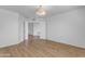 Bright bedroom features stylish wood floors, a light fixture, and two door ways at 4200 N Miller Rd # 325, Scottsdale, AZ 85251