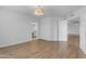 Bright bedroom features stylish wood floors, a light fixture, and two door ways at 4200 N Miller Rd # 325, Scottsdale, AZ 85251