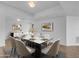 Bright dining room featuring a marble top table, decor, modern lighting and neutral-toned walls at 4200 N Miller Rd # 325, Scottsdale, AZ 85251