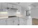 Bright kitchen featuring white cabinets, countertops, and stainless steel appliances at 4200 N Miller Rd # 325, Scottsdale, AZ 85251
