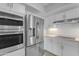 A well-equipped kitchen featuring stainless steel appliances, white cabinetry, and modern countertops at 4200 N Miller Rd # 325, Scottsdale, AZ 85251