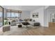 Contemporary living room with a large sectional couch, bright light, and modern decor at 4200 N Miller Rd # 325, Scottsdale, AZ 85251