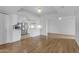 Bright, open living area featuring wood floors and a modern kitchen with stainless steel appliances at 4200 N Miller Rd # 325, Scottsdale, AZ 85251
