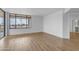 Living room with hardwood floors, large windows and a view from the adjacent balcony at 4200 N Miller Rd # 325, Scottsdale, AZ 85251
