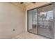 Inviting patio with tile flooring and sliding glass doors, offering a seamless indoor-outdoor transition at 4200 N Miller Rd # 325, Scottsdale, AZ 85251