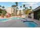 Resort-style pool area with lush landscaping, comfortable seating, and a relaxing hot tub at 4200 N Miller Rd # 325, Scottsdale, AZ 85251
