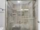 A modern shower has gray tile and glass doors, offering a sleek design at 4200 N Miller Rd # 325, Scottsdale, AZ 85251