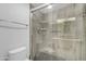 A modern shower has gray tile and glass doors, offering a sleek design at 4200 N Miller Rd # 325, Scottsdale, AZ 85251
