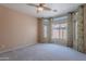 Inviting bedroom with soft carpeting and natural light streaming through the large windows at 440 S Val Vista Dr # 11, Mesa, AZ 85204