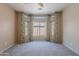 Spacious carpeted bedroom with bay windows and decorative curtains, enhancing natural light at 440 S Val Vista Dr # 11, Mesa, AZ 85204