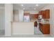 Spacious kitchen with wooden cabinets, modern appliances, granite countertops and breakfast bar at 440 S Val Vista Dr # 11, Mesa, AZ 85204
