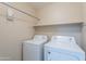 Laundry room featuring a washer, dryer, and shelf space at 440 S Val Vista Dr # 11, Mesa, AZ 85204