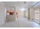 Bright, open living room with tile floors, neutral walls, and sliding door access to the backyard at 440 S Val Vista Dr # 11, Mesa, AZ 85204