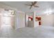 Open living room area with tile floors connecting to the kitchen and front entryway at 440 S Val Vista Dr # 11, Mesa, AZ 85204