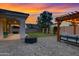 Backyard features a patio, pergola with lights, and lush green lawn at 4543 S Nebula --, Mesa, AZ 85212