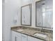 The spacious bathroom features a dual sink vanity with granite countertops and a tile shower at 4543 S Nebula --, Mesa, AZ 85212