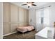 Cozy bedroom featuring a paneled accent wall, neutral decor and a bright window at 4543 S Nebula --, Mesa, AZ 85212
