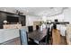 Open-concept dining room and kitchen area featuring contemporary design and hardwood floors at 4543 S Nebula --, Mesa, AZ 85212