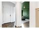 Welcoming foyer with stylish green accent wall, elegant decor and hardwood floors at 4543 S Nebula --, Mesa, AZ 85212