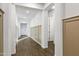 Hallway with wood floors, neutral wall color and decorative trim, creating a warm and inviting space at 4543 S Nebula --, Mesa, AZ 85212