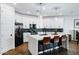 Modern kitchen features white cabinets, a large island, and stainless steel appliances at 4543 S Nebula --, Mesa, AZ 85212