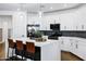 Stylish kitchen featuring a center island with seating, pendant lights, and modern appliances at 4543 S Nebula --, Mesa, AZ 85212