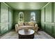 Living room features green trim and walls and a large, comfortable sofa at 4543 S Nebula --, Mesa, AZ 85212