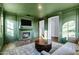 Inviting living room features a fireplace, TV, and doorway with decorative trim at 4543 S Nebula --, Mesa, AZ 85212