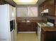 Functional kitchen featuring wood cabinetry and ample sunlight at 4568 W Maryland Ave, Glendale, AZ 85301