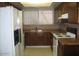 Functional kitchen featuring wood cabinetry and ample sunlight at 4568 W Maryland Ave, Glendale, AZ 85301
