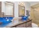 Modern bathroom with dual vessel sinks and a glass-enclosed shower at 4800 N 68Th St # 357, Scottsdale, AZ 85251
