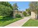 Well-maintained home exterior with manicured lawn and walkway at 4800 N 68Th St # 357, Scottsdale, AZ 85251