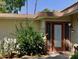 Close-up of the front door of the home, with desert landscaping and a well-maintained entrance at 4800 N 68Th St # 357, Scottsdale, AZ 85251
