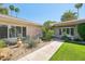 Beautiful single-story home featuring desert landscaping, a lush green lawn, and a welcoming walkway at 4800 N 68Th St # 357, Scottsdale, AZ 85251