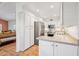 Bright kitchen featuring white cabinets, stainless steel appliances, and tiled floors at 4800 N 68Th St # 357, Scottsdale, AZ 85251