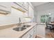 Featuring double sinks, the kitchen has white subway tiles and light countertops at 4800 N 68Th St # 357, Scottsdale, AZ 85251
