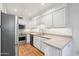 Well-lit kitchen with stainless steel appliances and white cabinetry at 4800 N 68Th St # 357, Scottsdale, AZ 85251