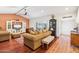 Spacious living room with comfortable seating, brick accent wall, and tile flooring at 4800 N 68Th St # 357, Scottsdale, AZ 85251
