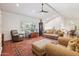 Bright living room with hardwood floors, plenty of seating, and a large area rug at 4800 N 68Th St # 357, Scottsdale, AZ 85251