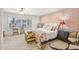 The main bedroom has wood-style flooring and a pink accent wall at 4800 N 68Th St # 357, Scottsdale, AZ 85251