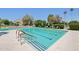 Relaxing community pool with lounge chairs and beautiful landscaping creating a resort-like atmosphere at 4800 N 68Th St # 357, Scottsdale, AZ 85251