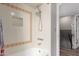 Bright bathroom featuring decorative tile accents and a shower with dual showerheads at 4818 E Hazel Dr # 1, Phoenix, AZ 85044