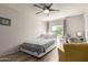 Comfortable bedroom with ceiling fan and window, offering a relaxing space at 4818 E Hazel Dr # 1, Phoenix, AZ 85044