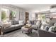 Comfortable living room featuring stylish decor, large windows, and an open layout at 4818 E Hazel Dr # 1, Phoenix, AZ 85044