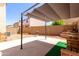 The backyard features a patio area with shade covering, an outdoor grill, and desert landscaping at 4925 S 5Th Ave, Phoenix, AZ 85041
