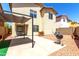 The backyard boasts desert landscaping, a built-in barbecue grill, and a covered patio at 4925 S 5Th Ave, Phoenix, AZ 85041