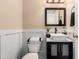 Stylish powder room features a vessel sink on a dark vanity and modern fixtures at 4925 S 5Th Ave, Phoenix, AZ 85041