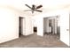 The bedroom features a ceiling fan, neutral carpet, and multiple doorways at 4925 S 5Th Ave, Phoenix, AZ 85041