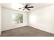 The room has carpet and a window at 4925 S 5Th Ave, Phoenix, AZ 85041