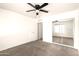 This bedroom offers ample closet space with mirrored doors, complemented by neutral carpet and walls at 4925 S 5Th Ave, Phoenix, AZ 85041